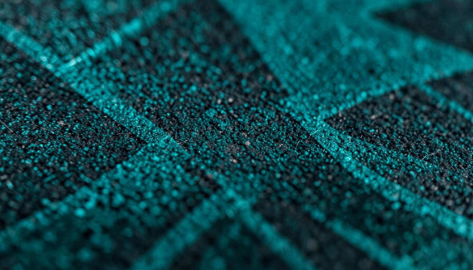 Dark abstract texture with subtle geometric patterns in deep teal and charcoal tones